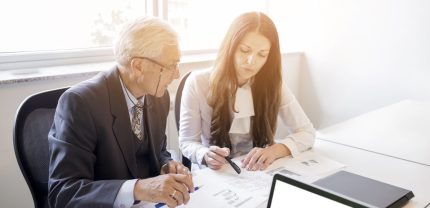 businessman-businesswoman-discussing-business-plan-with-chart-scaled.jpg