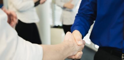 crop-shot-men-shaking-hands