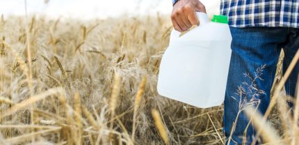 insecticide-canister-wheat-field