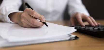 man-calculating-writing-close-up