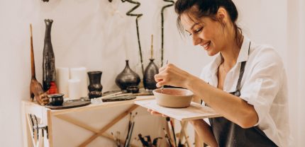 Woman craftmaster at a pottery shop